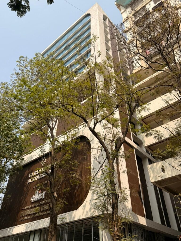 Vardhaman Business Bay signage wall with tower elevation visible above, Ghatkopar