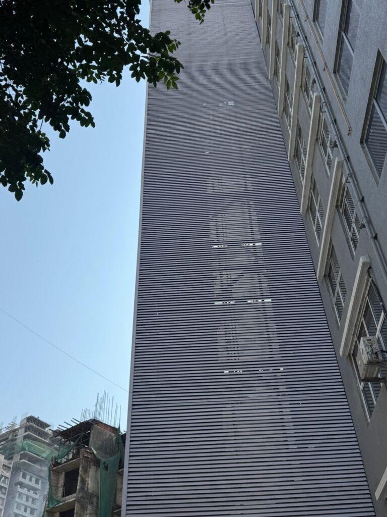 Full-height elevation of the Upvc fin-clad car parking tower at Sainath Residency, Bhandup