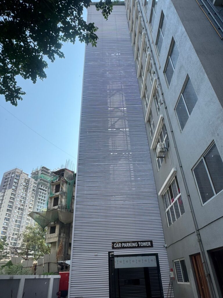 Sainath Residency car parking tower finished with horizontal Upvc Fins, Bhandup, alongside the main residential building