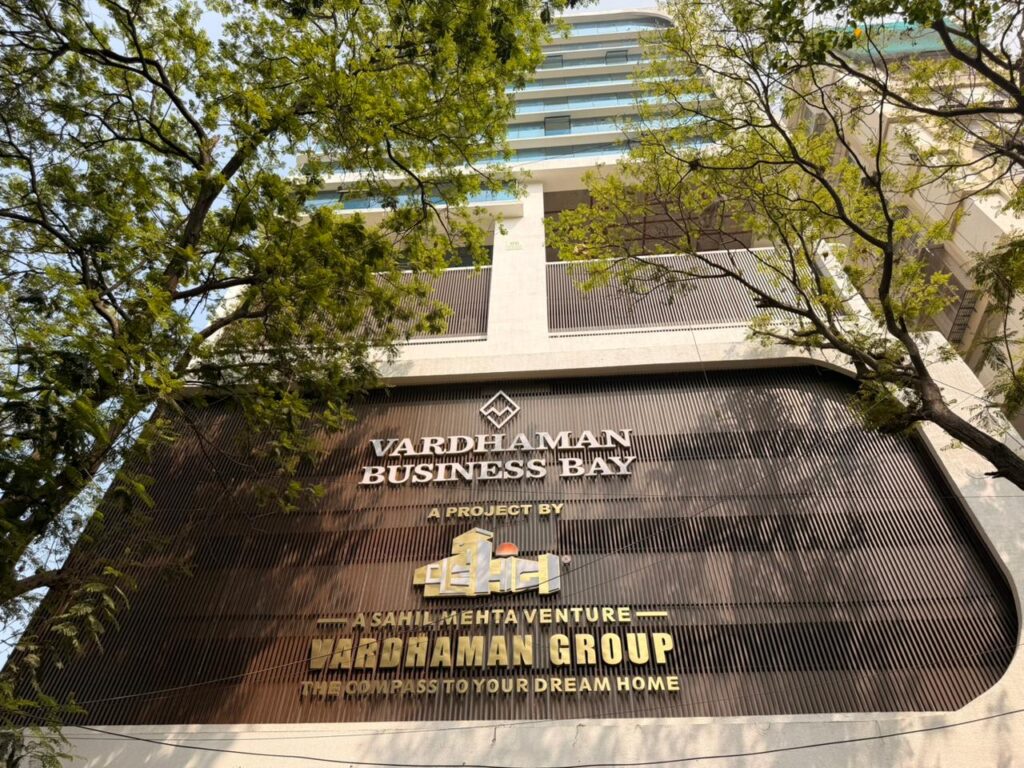Close view of Vardhaman Business Bay signage wall with dark brown Upvc Fins, ghatkopar