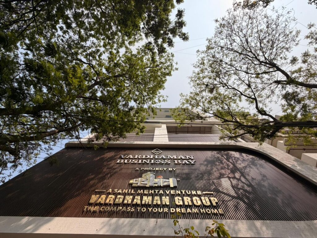 Street view of Vardhaman Business Bay façade with dark brown Upvc fin panels, Kharghar
