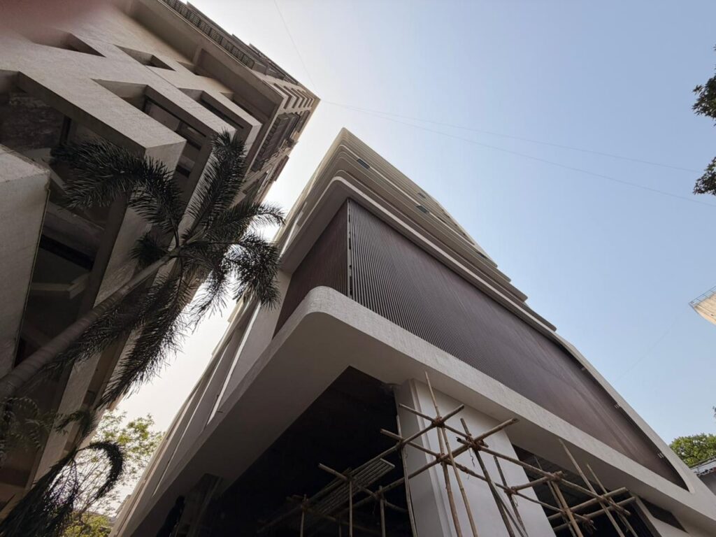 Dark brown Upvc Fins on the curved podium corner at Vardhaman Business Bay, Kharghar